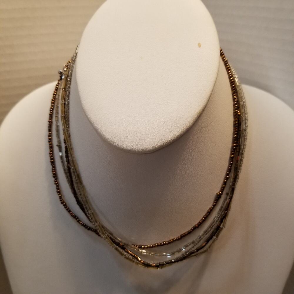 Bronze and clear seed bead five strand  necklace 14" with a 2 inch extension